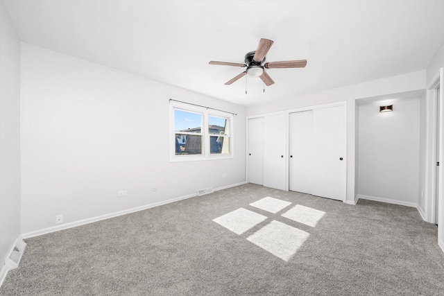 10417 Massasoit Ave, Oak Lawn, IL 60453 - unfurnished bedroom featuring two closets, light colored carpet, and a ceiling fan