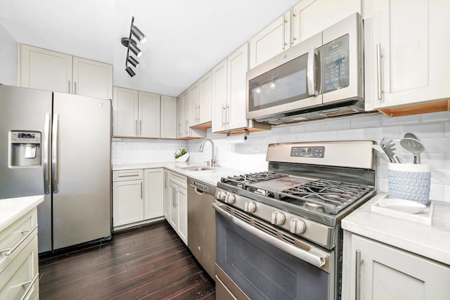 10417 Massasoit Ave, Oak Lawn, IL 60453 - kitchen with stainless steel appliances, dark wood-style floors, light countertops, and tasteful backsplash
