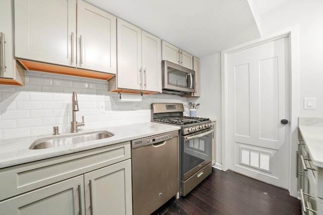 10417 Massasoit Ave, Oak Lawn, IL 60453 - kitchen featuring stainless steel appliances, dark wood-style flooring, light countertops, and backsplash