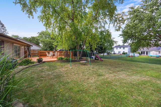 211 David Dr, Streamwood, IL 60107 - fenced backyard featuring a playground and a wooden deck