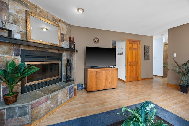 211 David Dr, Streamwood, IL 60107 - living room with a stone fireplace and wood finished floors