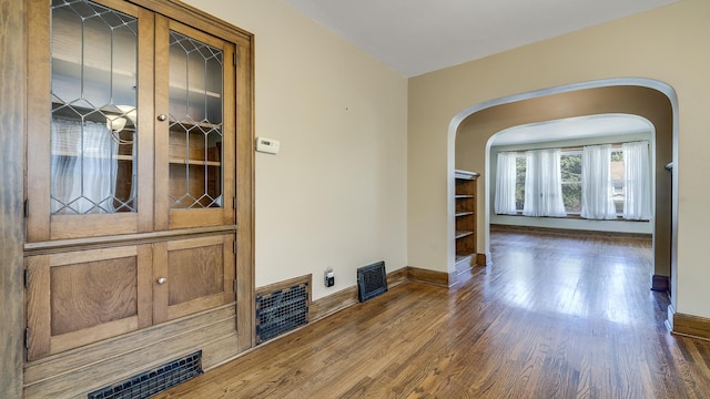 611 S Hennepin Ave, Dixon, IL 61021 - unfurnished room with wood finished floors and arched walkways