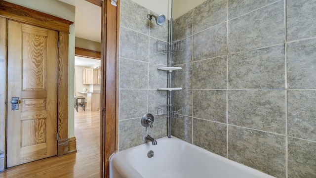 611 S Hennepin Ave, Dixon, IL 61021 - bathroom featuring shower / bath combination and wood finished floors