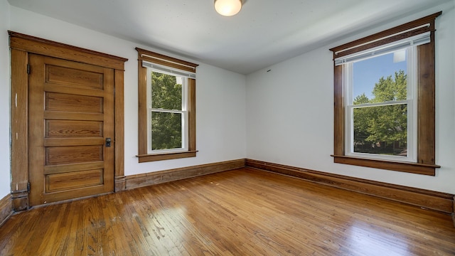 611 S Hennepin Ave, Dixon, IL 61021 - empty room featuring hardwood / wood-style flooring and baseboards