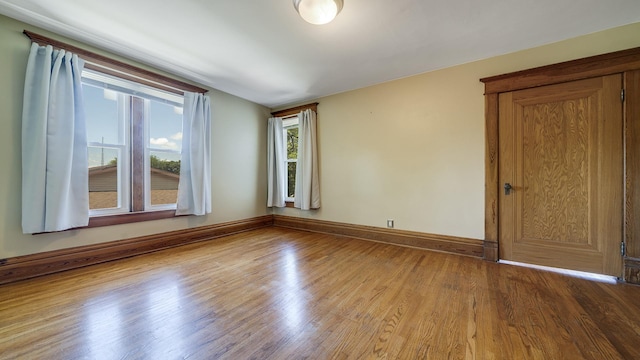 611 S Hennepin Ave, Dixon, IL 61021 - spare room with wood finished floors and baseboards