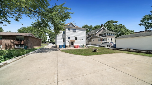 611 S Hennepin Ave, Dixon, IL 61021 - rear view of house with a yard and driveway