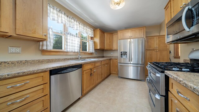 611 S Hennepin Ave, Dixon, IL 61021 - kitchen featuring appliances with stainless steel finishes and light tile patterned flooring