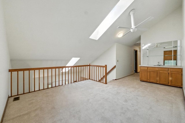 2S772 Timber Dr, Warrenville, IL 60555 - bonus room with a skylight, vaulted ceiling, light colored carpet, and ceiling fan