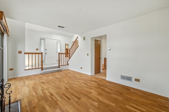 2S772 Timber Dr, Warrenville, IL 60555 - spare room featuring light wood-type flooring and stairs