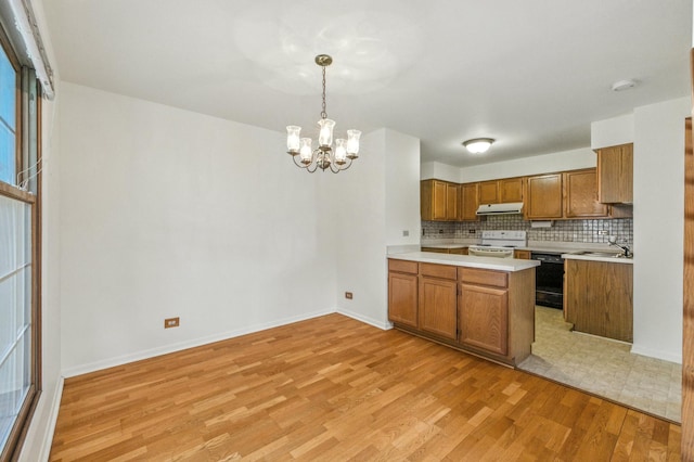 2S772 Timber Dr, Warrenville, IL 60555 - kitchen featuring brown cabinets, white range with electric cooktop, a chandelier, light countertops, and light wood finished floors