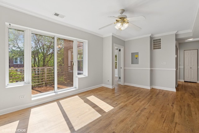 4610 N Monticello Ave Unit 3E, Chicago, IL 60625 - unfurnished room featuring electric panel, light wood finished floors, ornamental molding, and a ceiling fan