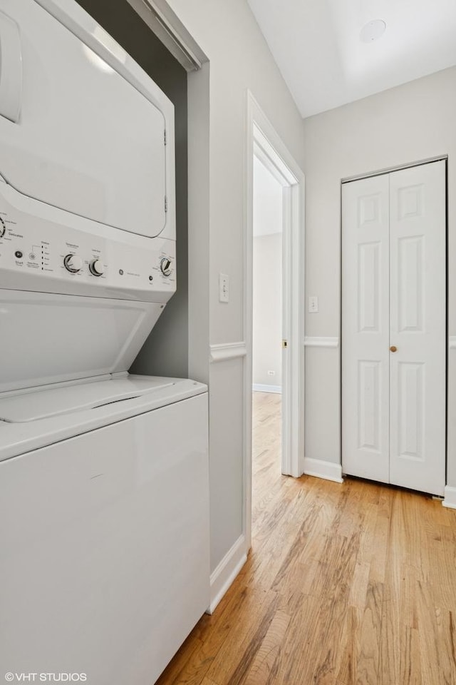 4610 N Monticello Ave Unit 3E, Chicago, IL 60625 - washroom with stacked washer / drying machine and light wood-style floors