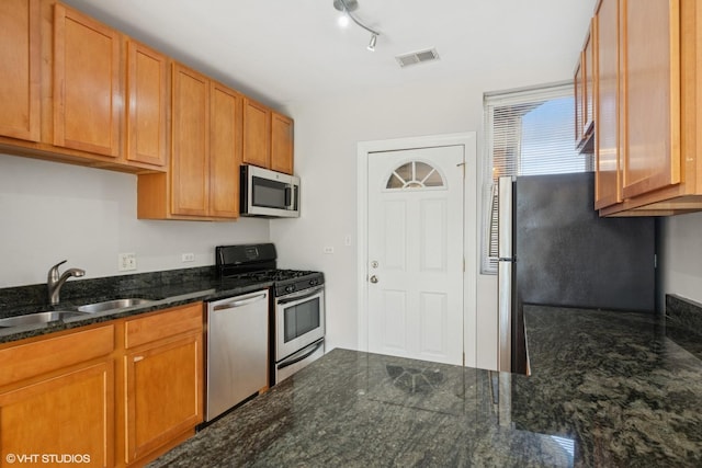 4610 N Monticello Ave Unit 3E, Chicago, IL 60625 - kitchen with stainless steel appliances and dark stone counters