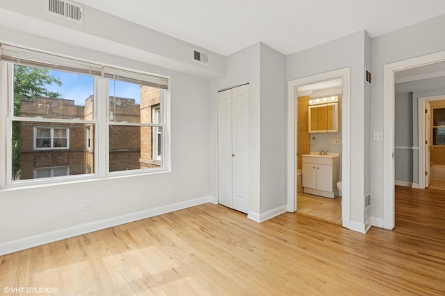 4610 N Monticello Ave Unit 3E, Chicago, IL 60625 - unfurnished bedroom with light wood finished floors, a closet, and ensuite bathroom