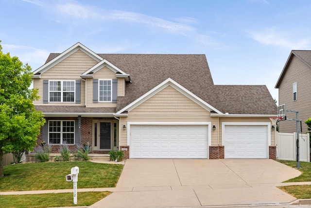 1312 Wicklow Dr, Bloomington, IL 61705 - view of front of house with brick siding, concrete driveway, a garage, and roof with shingles