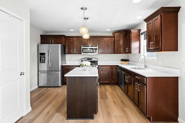 1312 Wicklow Dr, Bloomington, IL 61705 - kitchen featuring stainless steel appliances, a center island, light wood-style flooring, hanging light fixtures, and recessed lighting