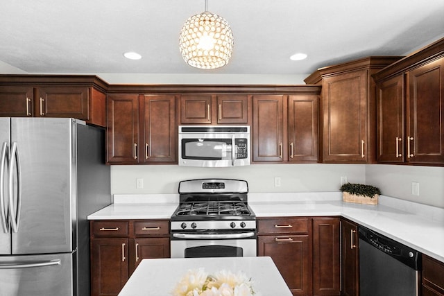 1312 Wicklow Dr, Bloomington, IL 61705 - kitchen featuring appliances with stainless steel finishes, light countertops, recessed lighting, and pendant lighting