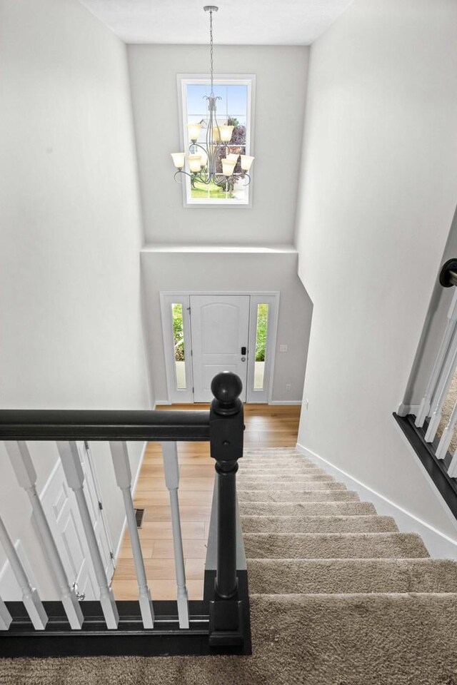 1312 Wicklow Dr, Bloomington, IL 61705 - stairs with a chandelier, healthy amount of natural light, and a high ceiling