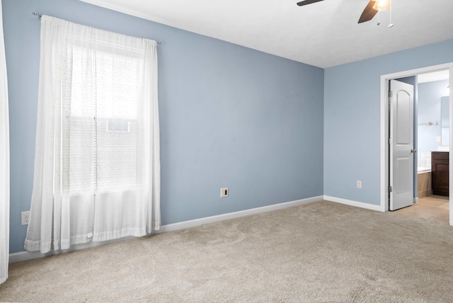 1312 Wicklow Dr, Bloomington, IL 61705 - unfurnished bedroom featuring carpet, ceiling fan, and ensuite bathroom
