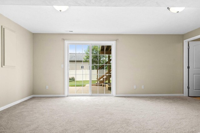1312 Wicklow Dr, Bloomington, IL 61705 - carpeted empty room featuring baseboards