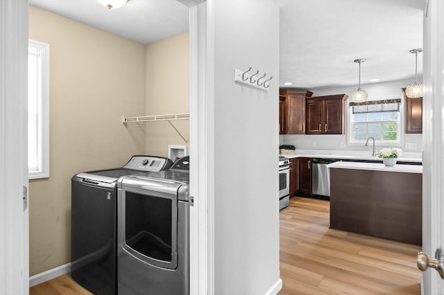 1312 Wicklow Dr, Bloomington, IL 61705 - laundry room with washer and dryer, light wood-style floors, and recessed lighting