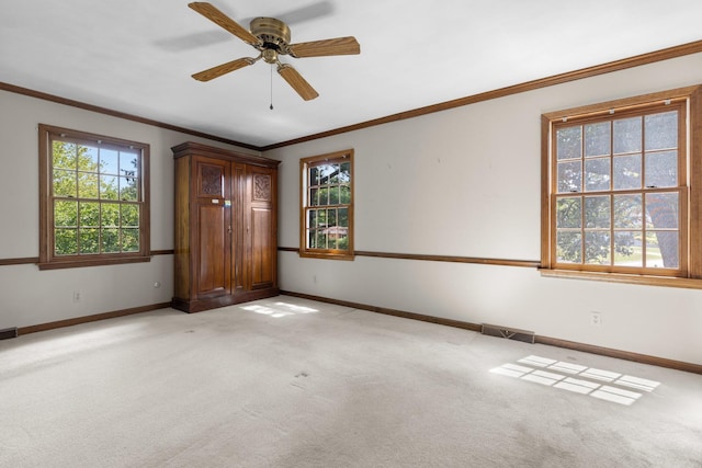 4113 Eaton Dr, Rockford, IL 61114 - unfurnished bedroom featuring crown molding, light carpet, and a ceiling fan