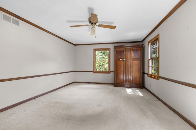 4113 Eaton Dr, Rockford, IL 61114 - empty room with light carpet, crown molding, and a ceiling fan