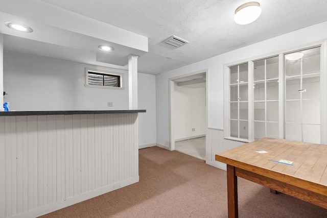 4113 Eaton Dr, Rockford, IL 61114 - kitchen featuring carpet flooring, a textured ceiling, and recessed lighting