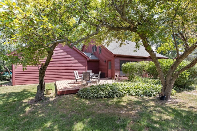 4113 Eaton Dr, Rockford, IL 61114 - back of house featuring a deck, a yard, and roof with shingles