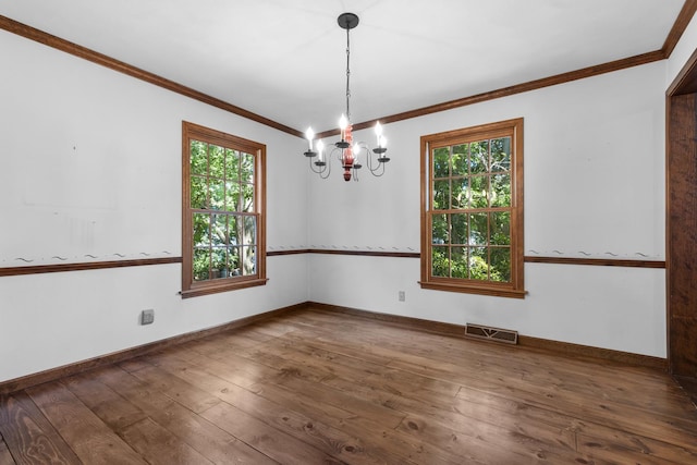 4113 Eaton Dr, Rockford, IL 61114 - empty room featuring ornamental molding, a chandelier, plenty of natural light, and wood-type flooring