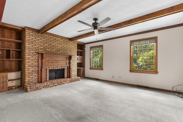 4113 Eaton Dr, Rockford, IL 61114 - unfurnished living room with carpet flooring, plenty of natural light, a fireplace, and beamed ceiling