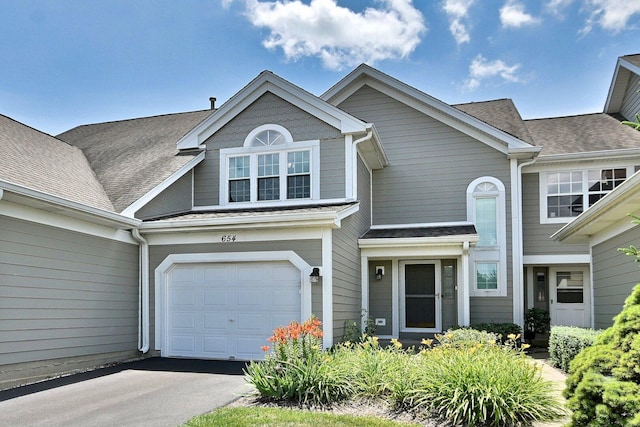 654 Kingsbridge Dr, Carol Stream, IL 60188 - multi unit property with an attached garage, asphalt driveway, and a shingled roof