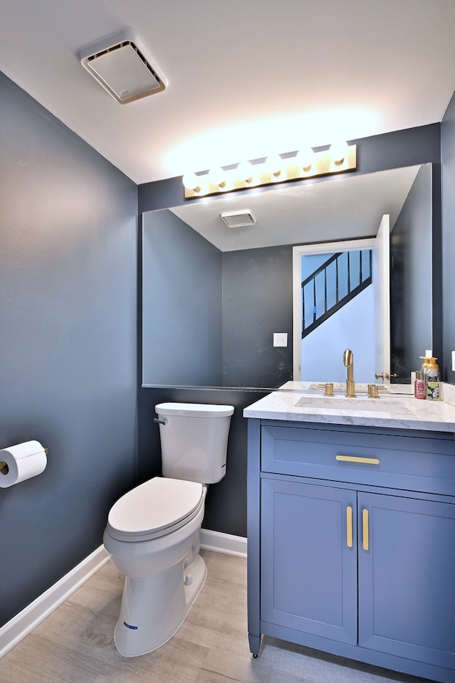 654 Kingsbridge Dr, Carol Stream, IL 60188 - half bath with vanity and wood finished floors