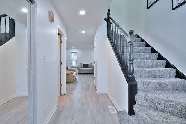654 Kingsbridge Dr, Carol Stream, IL 60188 - stairway with wood finished floors and recessed lighting