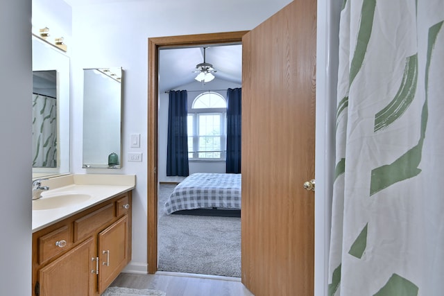654 Kingsbridge Dr, Carol Stream, IL 60188 - bathroom featuring vanity, wood finished floors, vaulted ceiling, a ceiling fan, and ensuite bathroom
