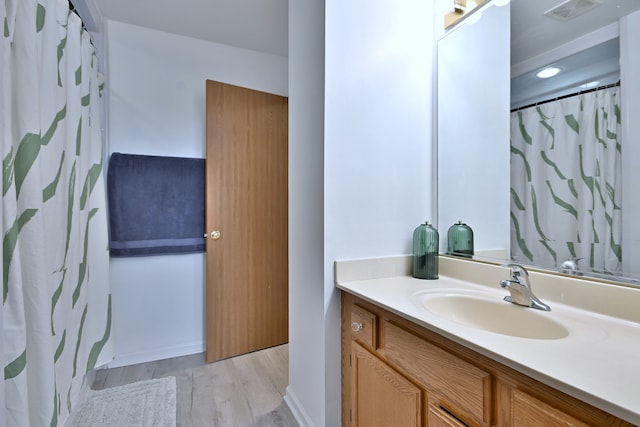 654 Kingsbridge Dr, Carol Stream, IL 60188 - full bathroom featuring vanity, wood finished floors, and a shower with shower curtain