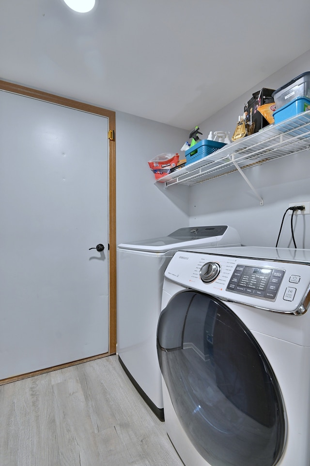 654 Kingsbridge Dr, Carol Stream, IL 60188 - washroom with separate washer and dryer and light wood-style flooring