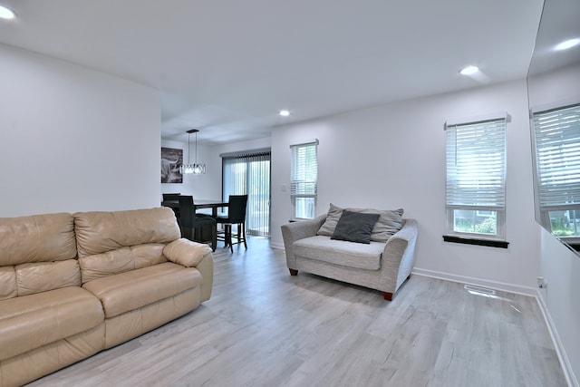 654 Kingsbridge Dr, Carol Stream, IL 60188 - living area featuring light wood-type flooring, plenty of natural light, recessed lighting, and a chandelier