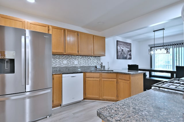 654 Kingsbridge Dr, Carol Stream, IL 60188 - kitchen featuring stainless steel refrigerator with ice dispenser, white dishwasher, a peninsula, light wood-type flooring, and dark stone countertops