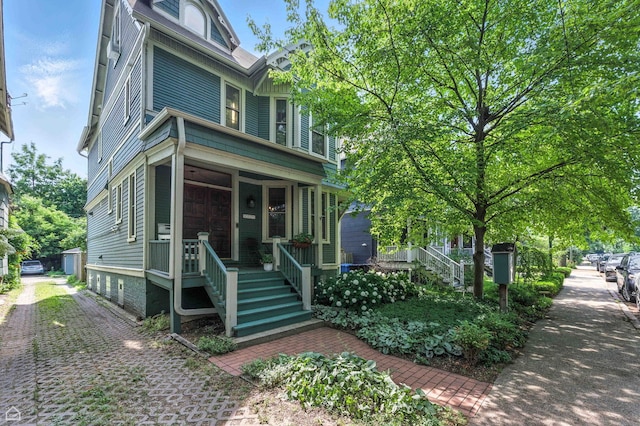 5729 S Harper Ave, Chicago, IL 60637 - view of front of property featuring a porch and stairs