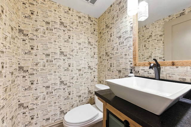 5729 S Harper Ave, Chicago, IL 60637 - half bath featuring vanity and tile walls