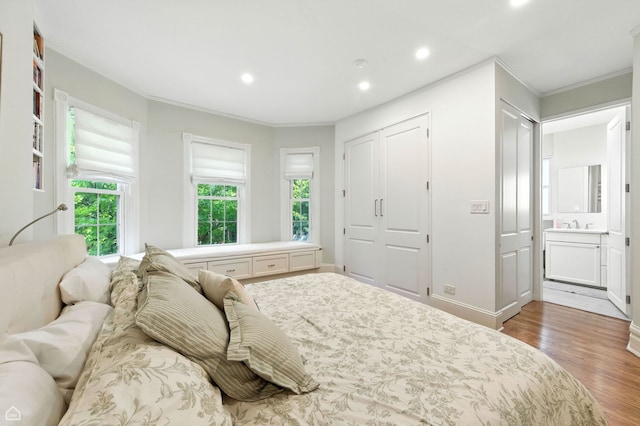 5729 S Harper Ave, Chicago, IL 60637 - bedroom featuring ornamental molding, wood finished floors, recessed lighting, and ensuite bath