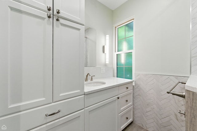 5729 S Harper Ave, Chicago, IL 60637 - bathroom with tile walls, vanity, and a wainscoted wall