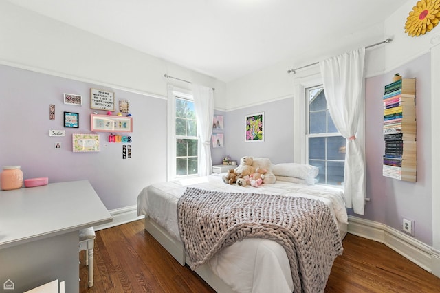 5729 S Harper Ave, Chicago, IL 60637 - bedroom featuring dark wood-style flooring and baseboards