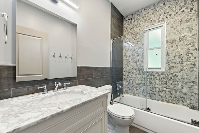 5729 S Harper Ave, Chicago, IL 60637 - full bath with tile walls, vanity, and combined bath / shower with glass door