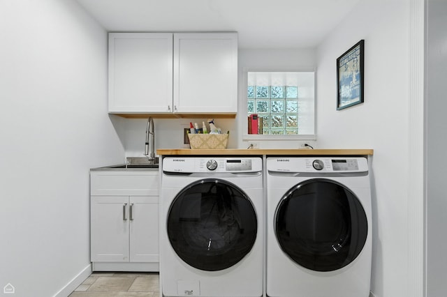 5729 S Harper Ave, Chicago, IL 60637 - laundry area featuring separate washer and dryer and cabinet space