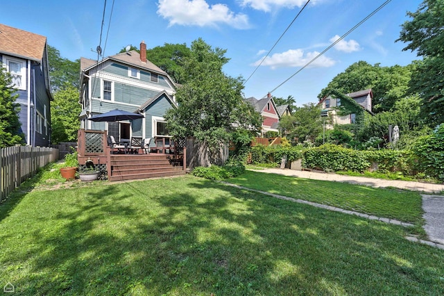 5729 S Harper Ave, Chicago, IL 60637 - rear view of property with a deck and a chimney
