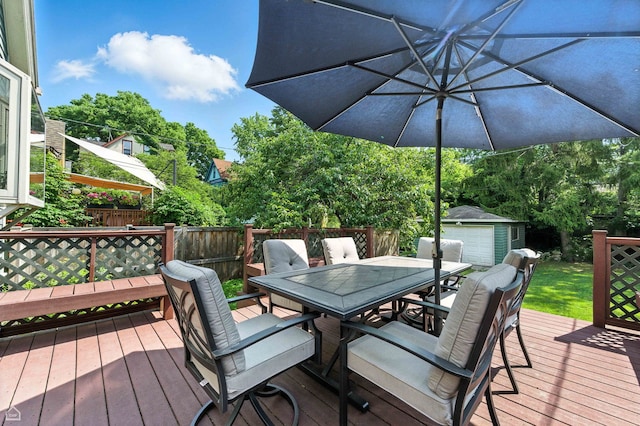 5729 S Harper Ave, Chicago, IL 60637 - deck with outdoor dining space and an outbuilding