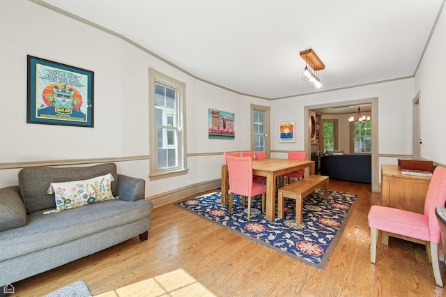 5729 S Harper Ave, Chicago, IL 60637 - dining room with a chandelier, wood finished floors, and ornamental molding