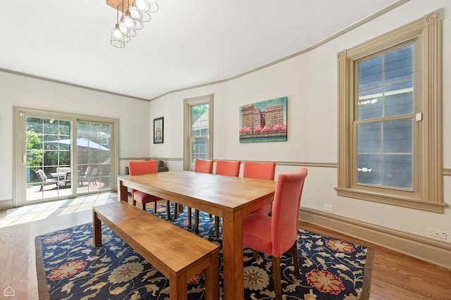5729 S Harper Ave, Chicago, IL 60637 - dining area with light wood-style floors and crown molding